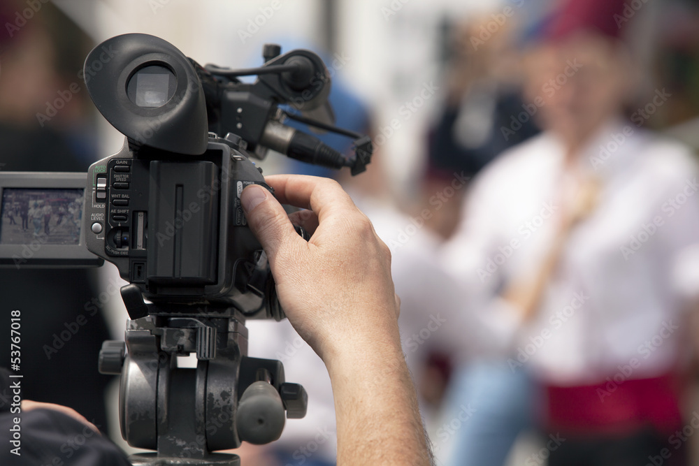 covering an event with a video camera covering an event with a video camera