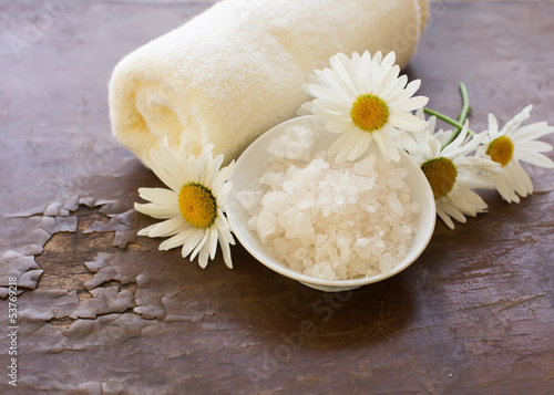 Spa products on wooden background. Sea salt with natural compone photo