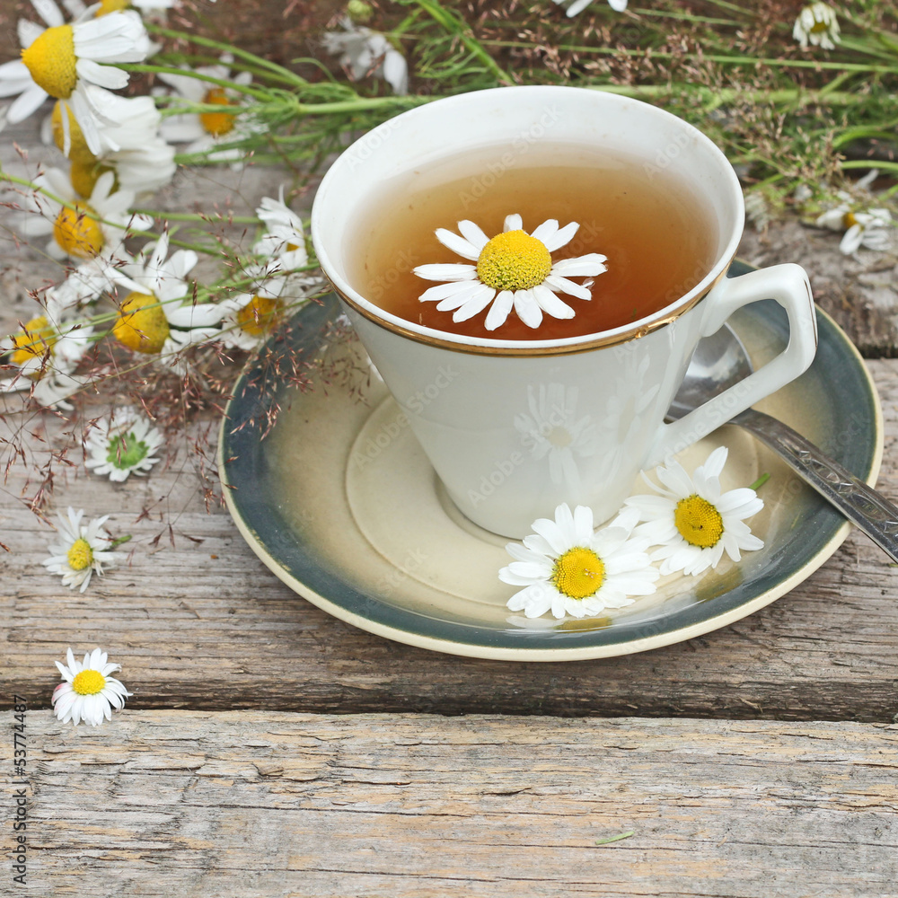 chamomile tea on wooden background chamomile tea on wooden background