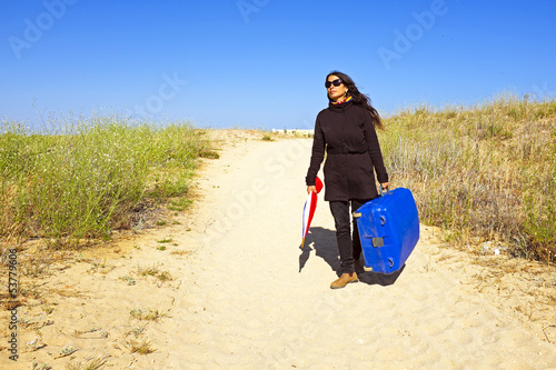 Woman travelling to her holiday destinatination photo