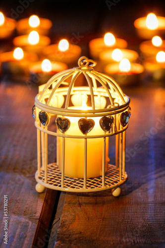 Oriental lantern on wooden table in the evening. Selective focus