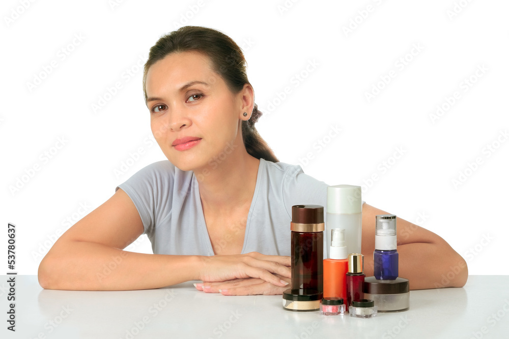 Isolated middle age asian woman with cosmetic cream Isolated middle age asian woman with cosmetic cream