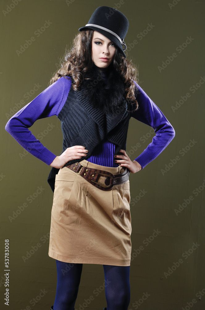 beautiful girl is in fashion style on dark background