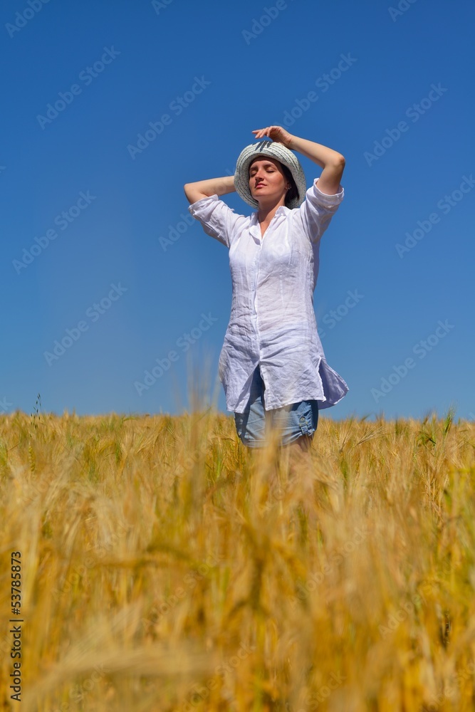 young woman in wheat field at summer young woman in wheat field at summer