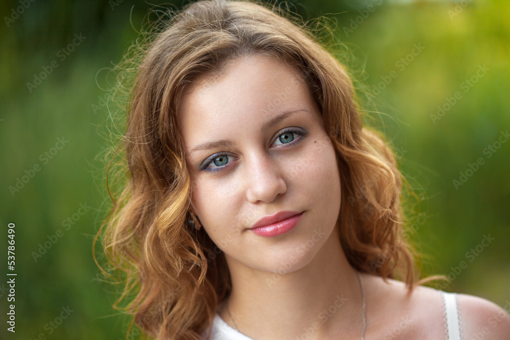 Naklejka premium Outdoor portrait of young pretty women with ginger hair