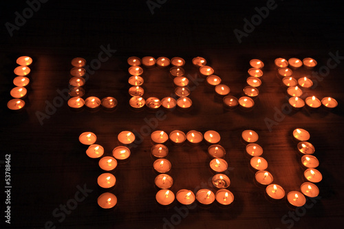 Romantic candles on dark background