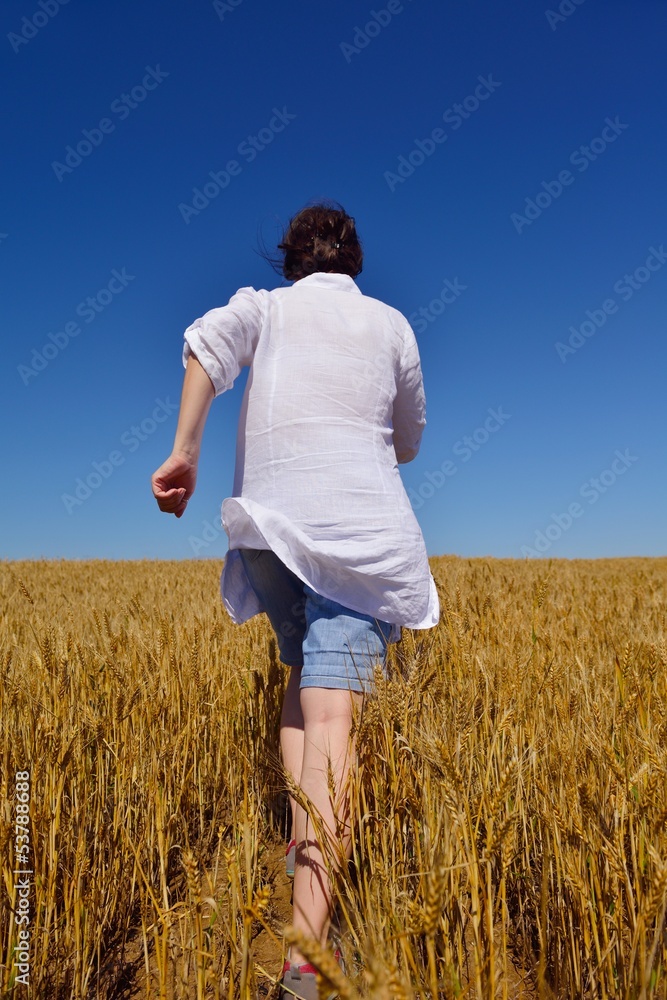 young woman in wheat field at summer young woman in wheat field at summer