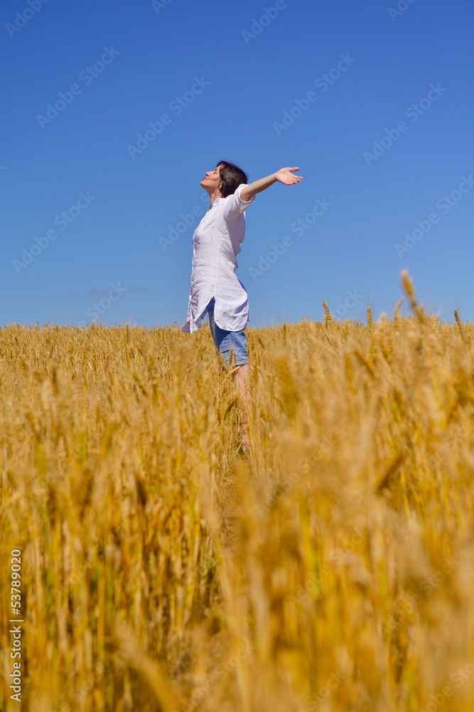 young woman in wheat field at summer young woman in wheat field at summer