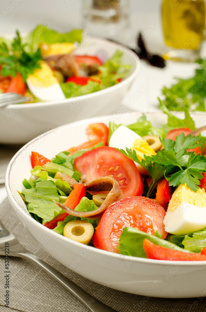 Salad Nicoise with tomatoes, beans, tuna, eggs and anchovies Salad Nicoise with tomatoes, beans, tuna, eggs and anchovies