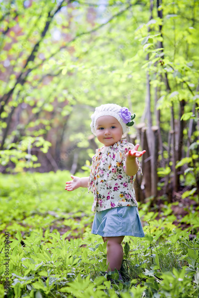 Portrait of little girl in a spring forest Portrait of little girl in a spring forest