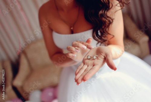 Canvas Print beautiful female hands with manicure holding bride's beautiful e