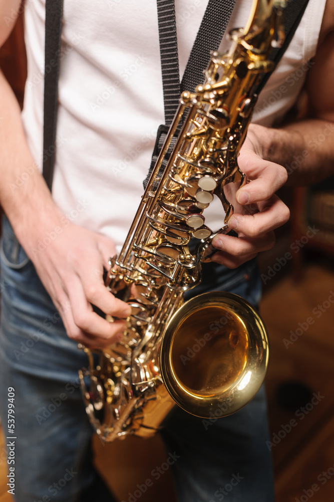 Obraz premium Men playing saxophone. Close up of men playing saxophone