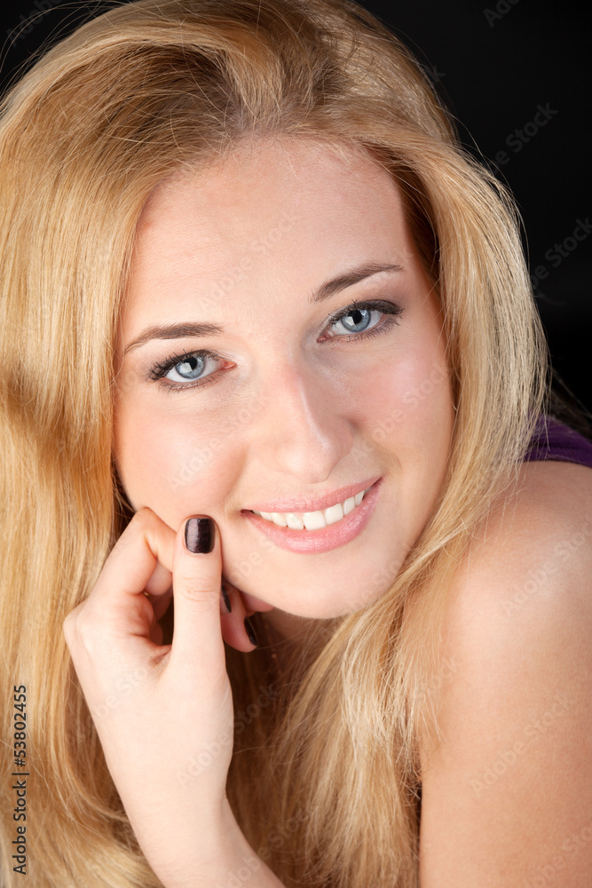 Portrait of the long-haired blonde with a white teeth smile Portrait of the long-haired blonde with a white teeth smile