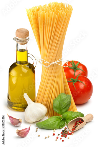 spaghetti, bottle of olive oil, tomatoes and herbs