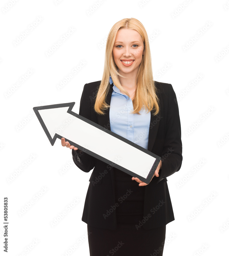 smiling businesswoman with direction arrow sign smiling businesswoman with direction arrow sign