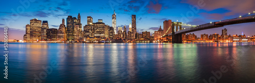 New York City skyline at night with Brooklyn Bridge