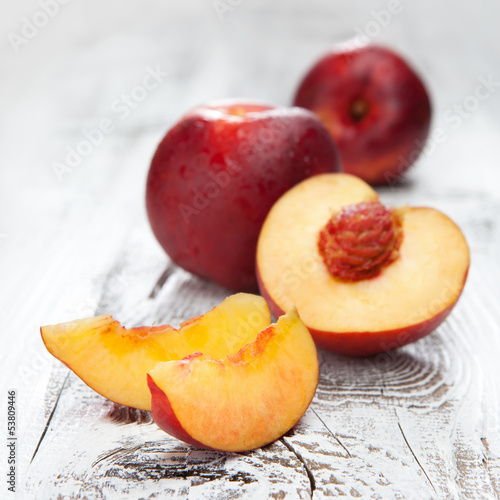 Fresh and tasty peaches on a table