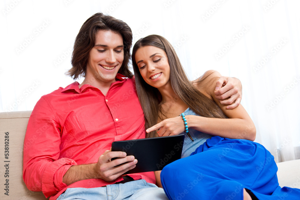 young couple with tablet young couple with tablet