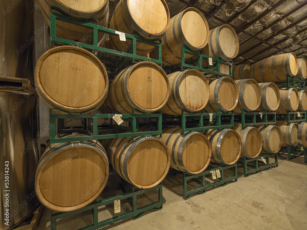 Wine barrels stacked in a cold warehouse