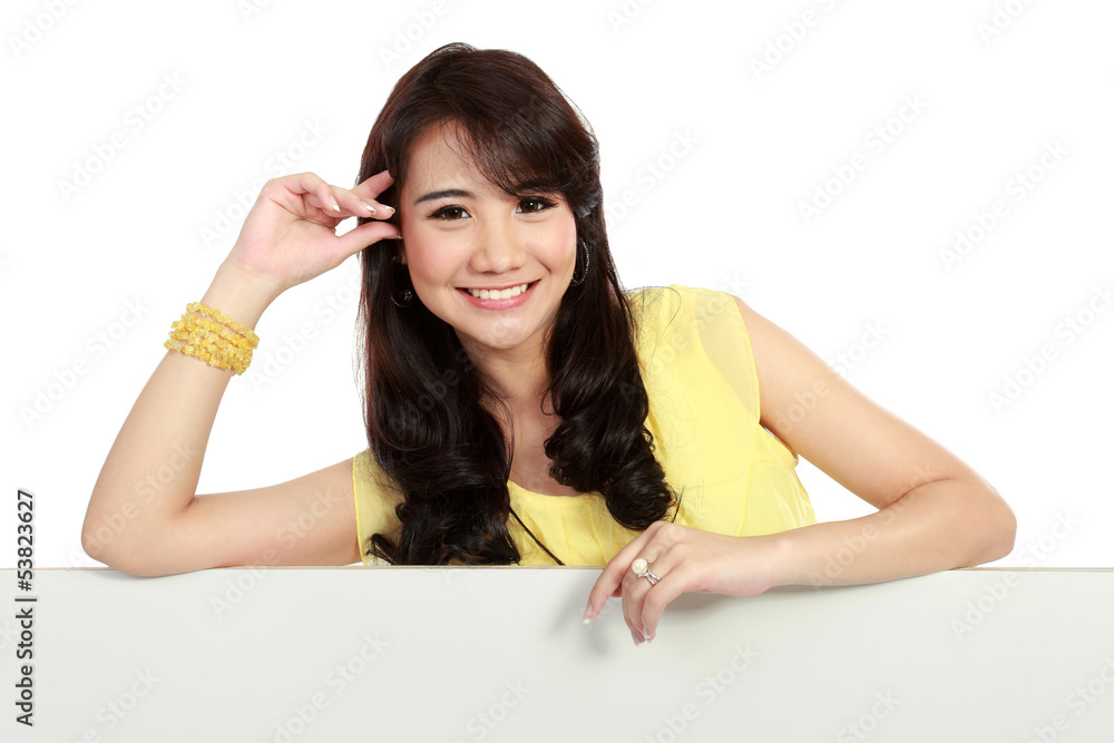 Smiling teenager girl holding blank white board Smiling teenager girl holding blank white board