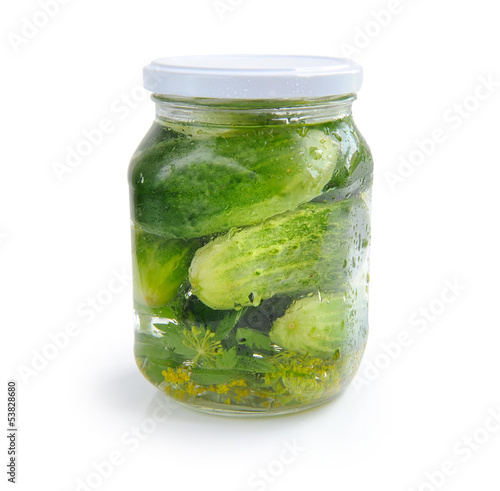 Glass jar with pickled cucumbers isolated on white background