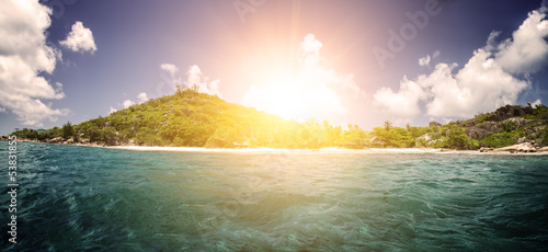 White coral sand on tropical beach. La Digue island, Seyshelles.