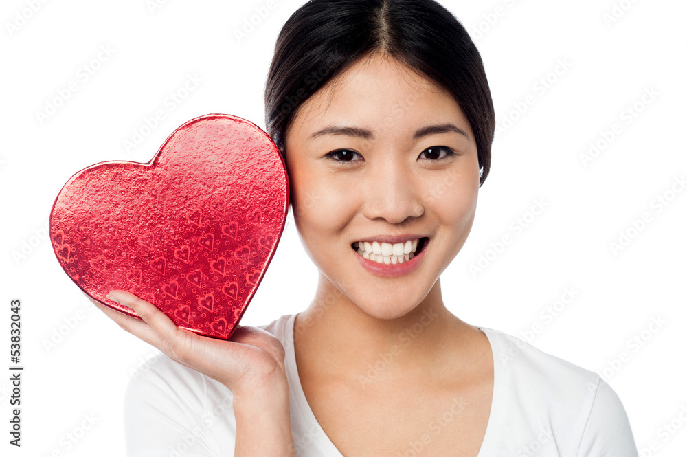 Woman displaying her valentine gift Woman displaying her valentine gift