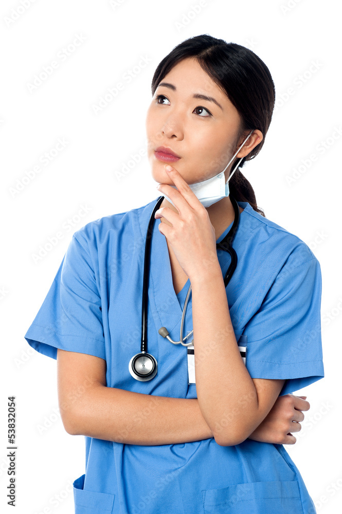 Female surgeon thinking something Female surgeon thinking something