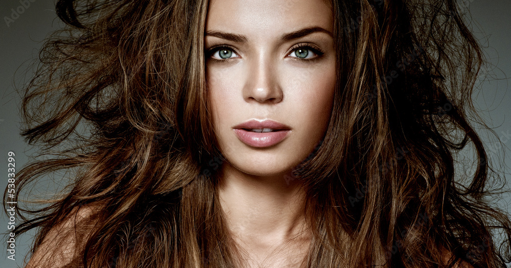 Naklejka premium beautiful brunette with gorgeous hair