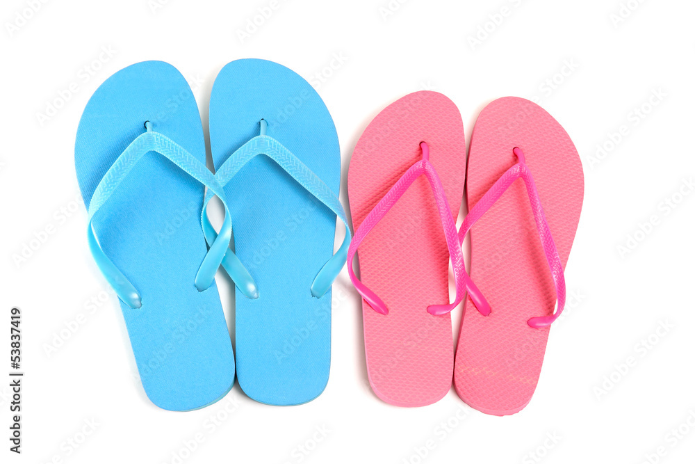 male and female flip flops over white male and female flip flops over white