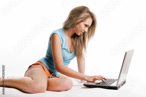 Young girl working with laptop photo