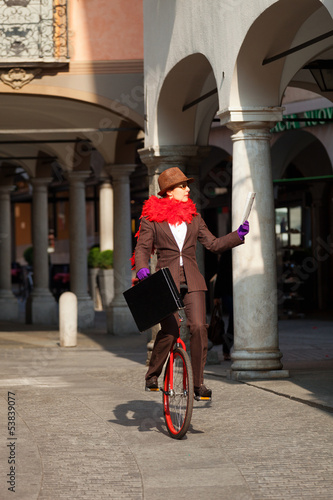 business woman go to work in monocycle photo