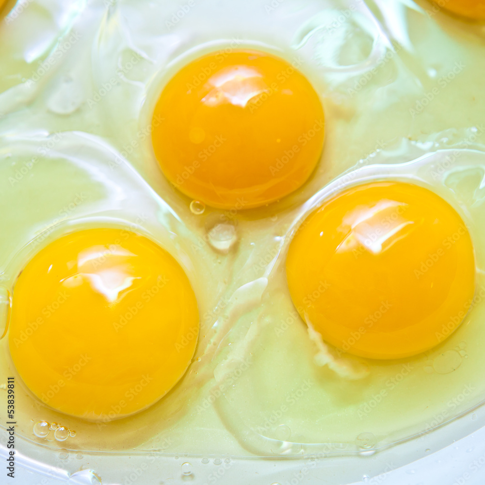 Crude protein and egg yolk in a frying pan Crude protein and egg yolk in a frying pan