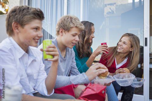 Friends enjoying fast food together