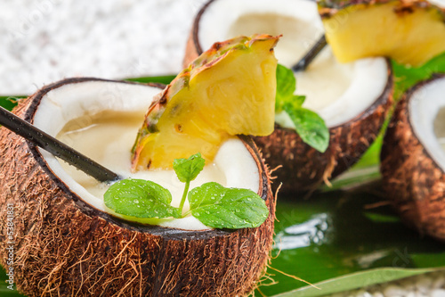 Closeup of pinacolada in a coconut