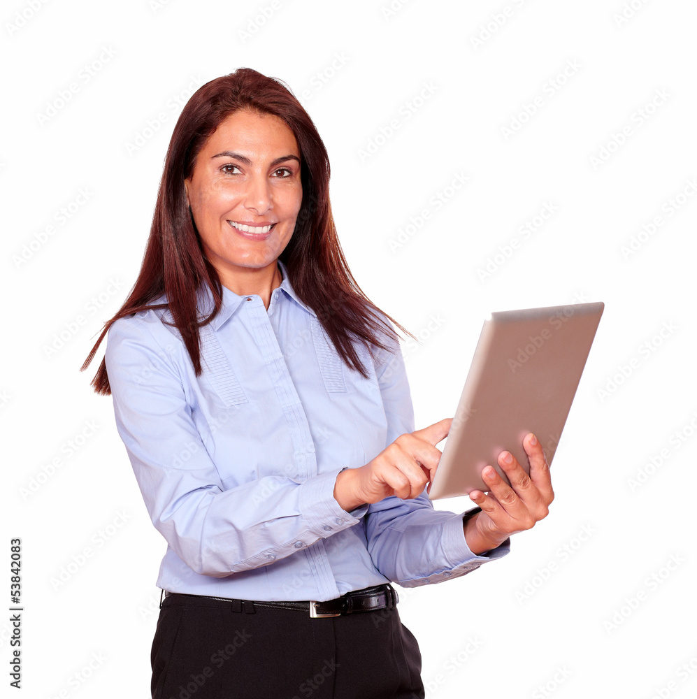 Smiling senior woman working on her tablet pc Smiling senior woman working on her tablet pc