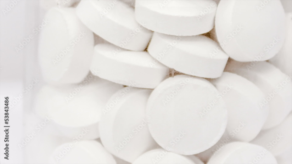 Medical pills placed on rotating table, shot with white seamless Medical pills placed on rotating table, shot with white seamless