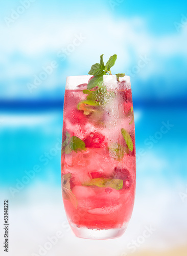 Summer drink with blur beach on background