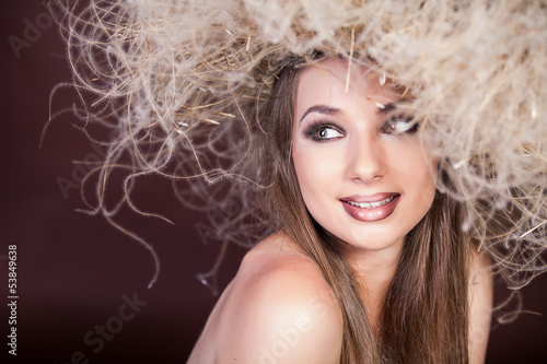 portrait of a beautiful naked girl with wreath on her head