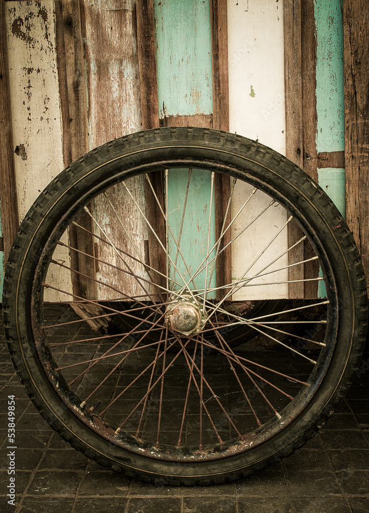Wheel and wood background