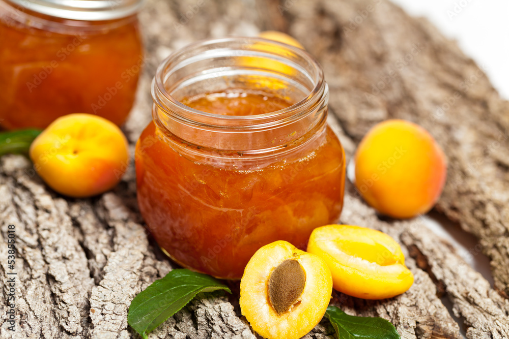 Apricot jam on wooden background Apricot jam on wooden background