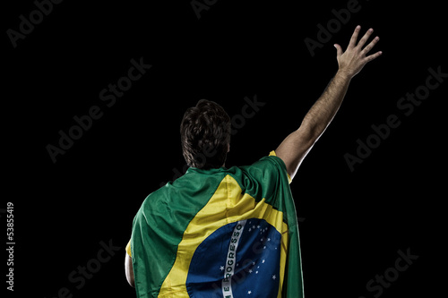 man with a Brazilian flag on his back