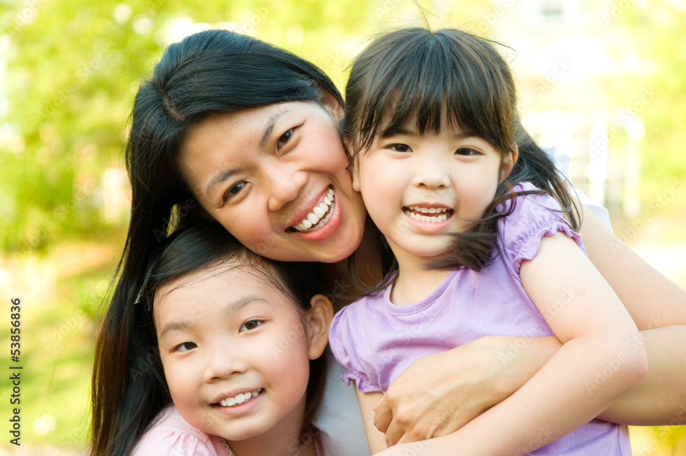Outdoor portrait of asian mother and daughters Outdoor portrait of asian mother and daughters