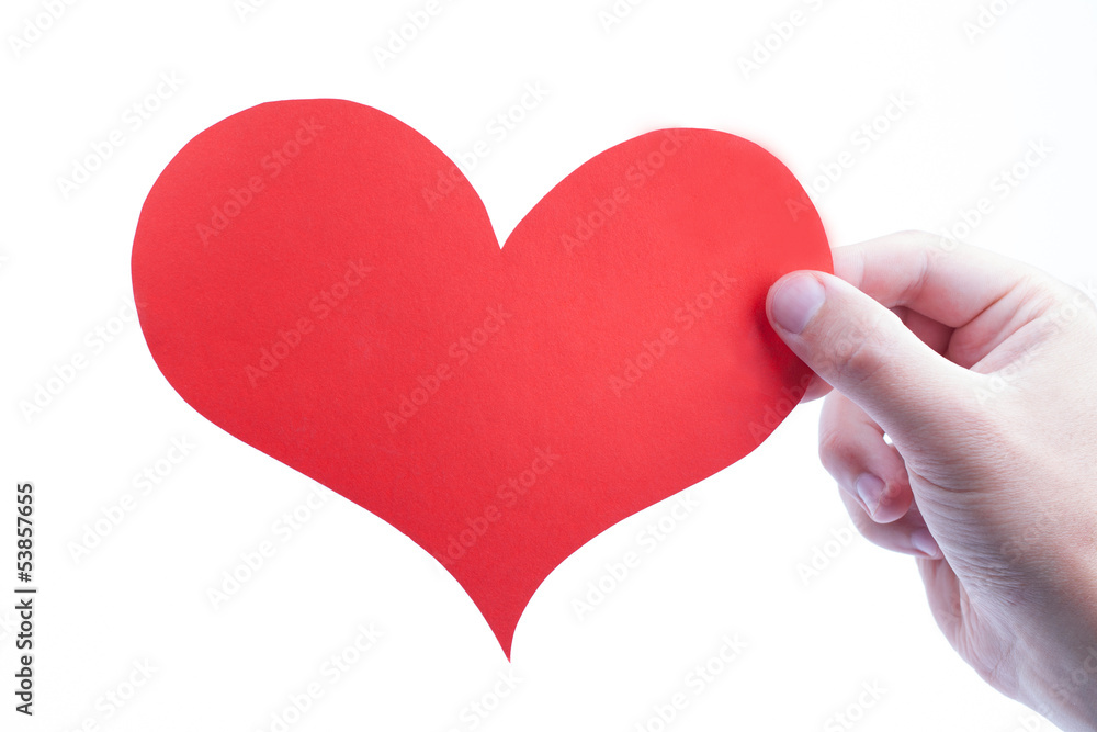 Hand holds heart isolated on a white backgrounds Hand holds heart isolated on a white backgrounds