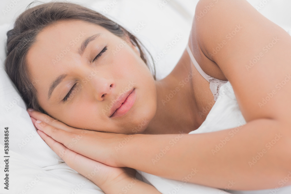 Calm woman sleeping in bed