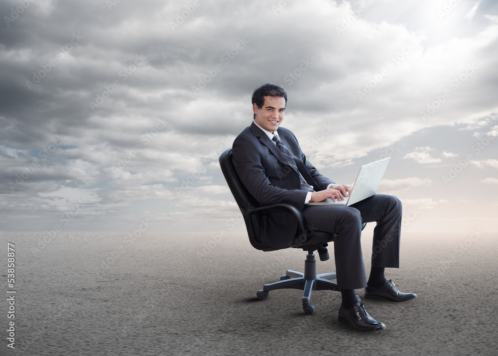 Handsome businessman sitting on a swivel chair Handsome businessman sitting on a swivel chair