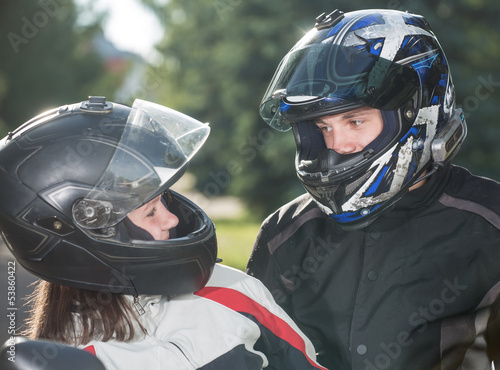 Two in motorcycle helmets