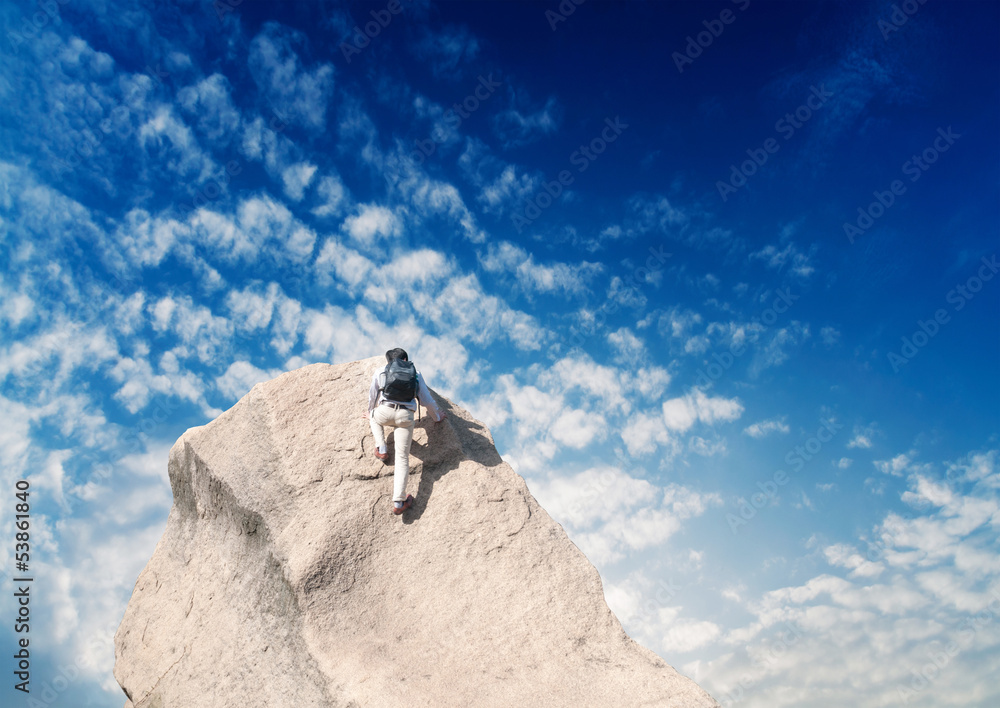 Young man climbing on a limestone wall