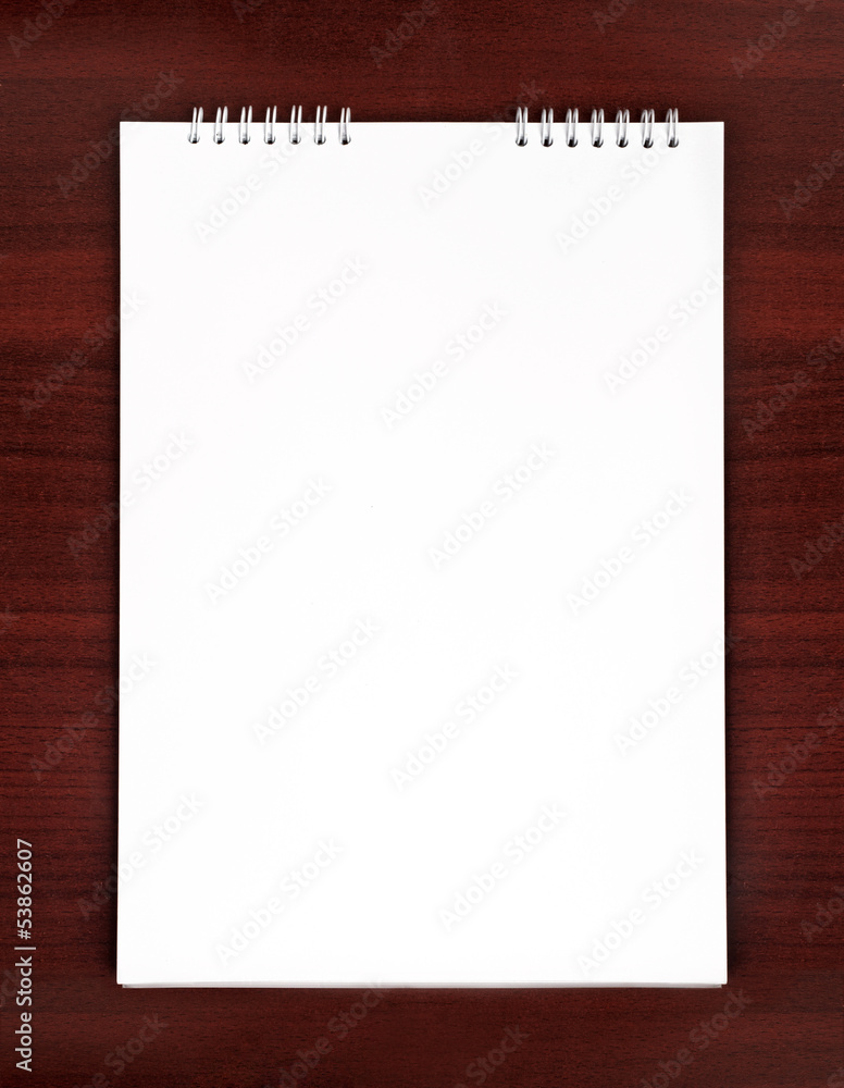 Empty notepad on wooden table Empty notepad on wooden table