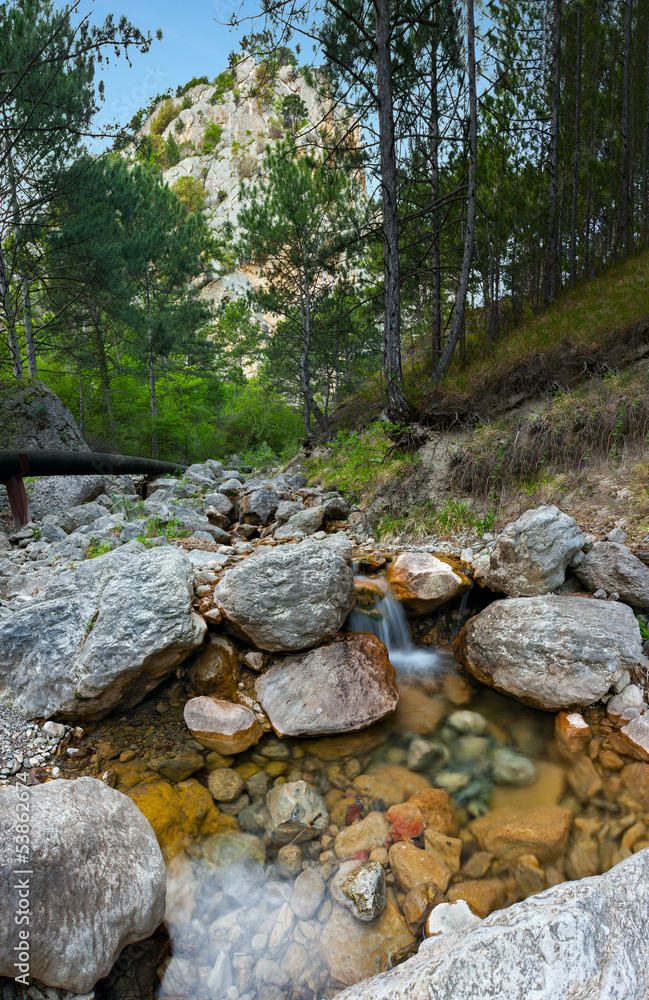 Mountain Landscape with Large Boulders and a Dry Riverbed Mountain Landscape with Large Boulders and a Dry Riverbed